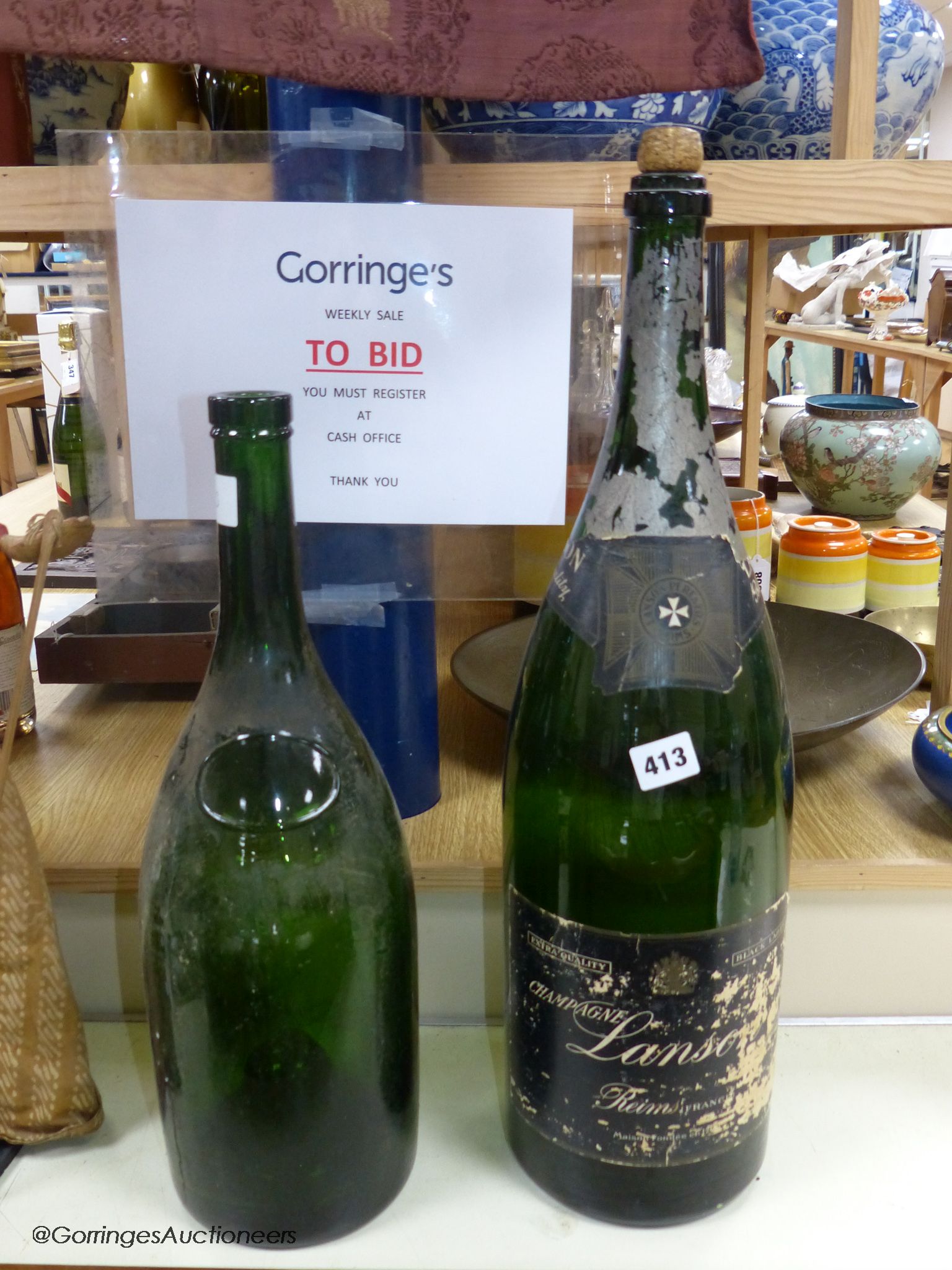 Two large wine / champagne empty bottles, tallest 60cm